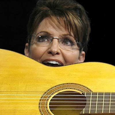 Sarah Palin taking a bite of Terry's guitar